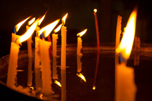 Church candles burn in the church
