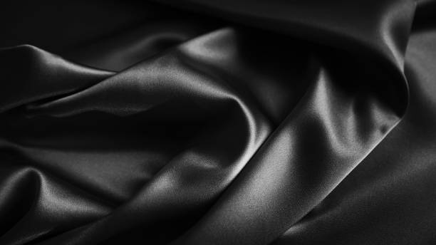 istock Black dark gray silver white background. Silk satin. Silky shiny smooth fabric. Elegant luxury beautiful. Silky shine shimmer silvery. 2188395394