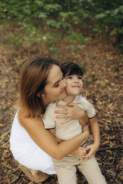 istock A mother and her son walking in nature 2188396437