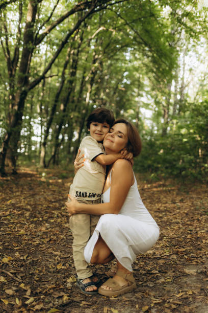 istock mother and son outdoors in the park 2188396443