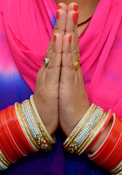 Indian woman greeting with folded hands