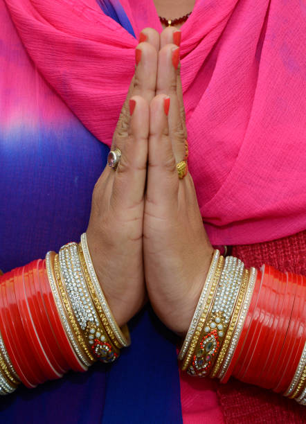 Indian woman greeting with folded hands