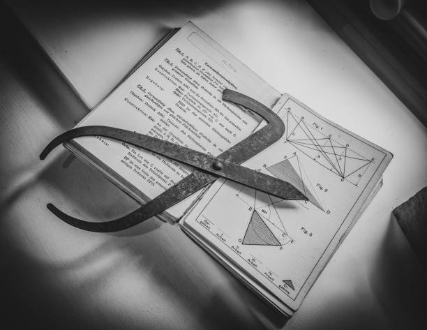 antique french curve ruler on geometry book