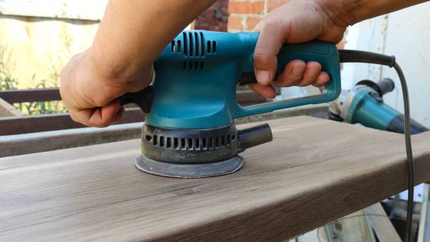 istock sanding a wooden surface with sandpaper 2188397885