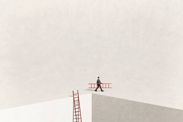istock Man Walks Away With Ladder 2188398257