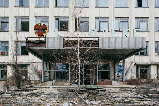 Pripyat, Ukraine  - April 15, 2021:   An abandoned building overgrown with trees in Pripyat, the Chernobyl zone