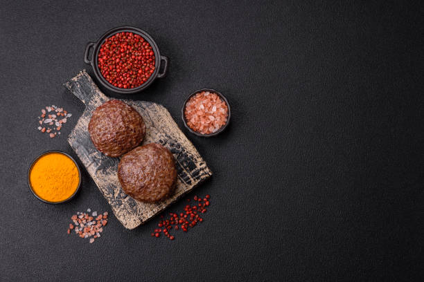 istock Beef burger patties with salt, spices and herbs 2188401482