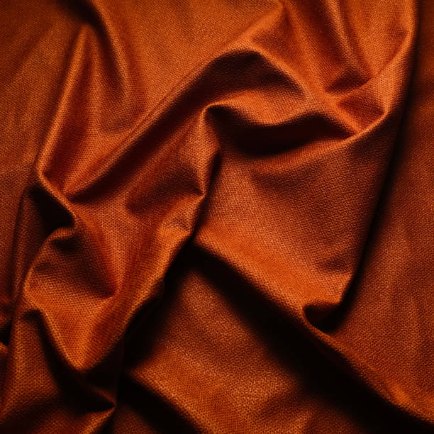 istock orange color crumpled textile fabric 2188409317