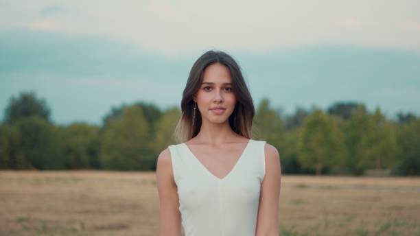 A woman in a red dress in nature in autumn.
