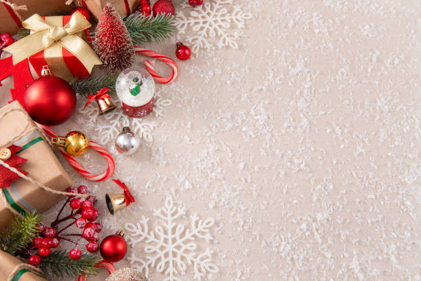 Vintage Christmas background with gift boxes, ornaments, holly berries, and candy canes