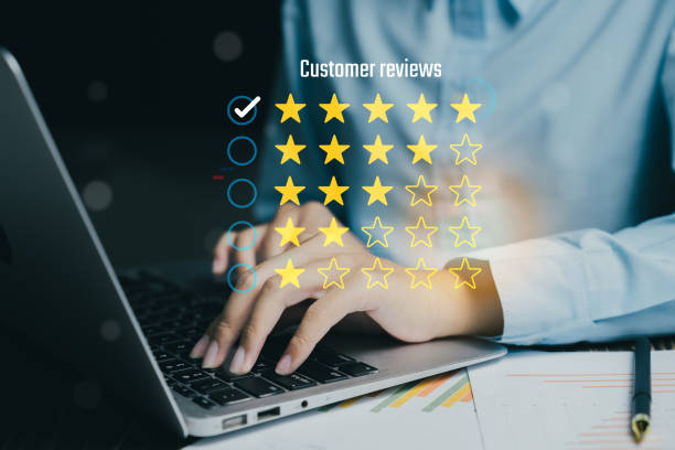 istock Customer reviews displayed on laptop screen, showcasing star ratings and feedback. image captures essence of online evaluations and customer satisfaction 2188412656