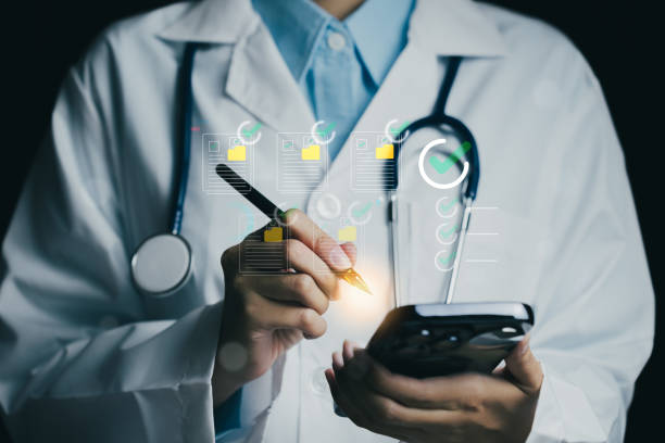 istock healthcare professional in lab coat uses smartphone while taking notes. image conveys sense of modern medical practice and technology integration in healthcare 2188412681
