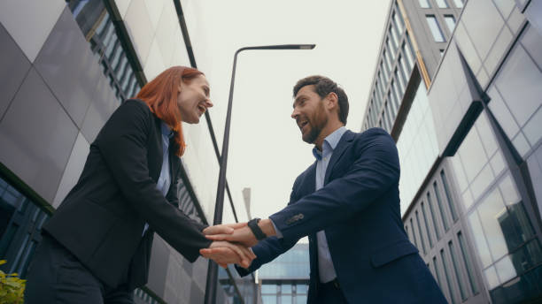 istock Happy successful smiling Caucasian business people stack hands put palms together united employees friends partners teamwork partnership colleagues support trust in city businessman businesswoman 2188415273