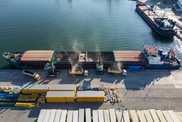 istock Aerial view of bulk carrier loading from truck 2188415570