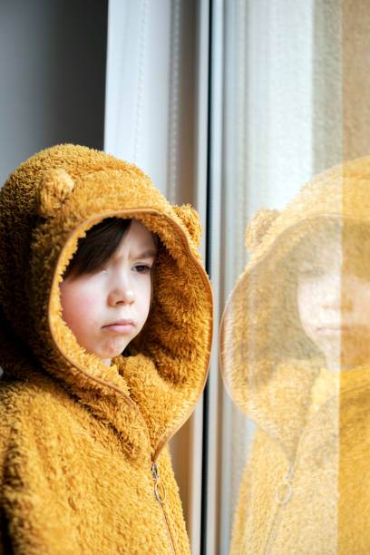 istock Portrait of a sad lonely child 2188422712
