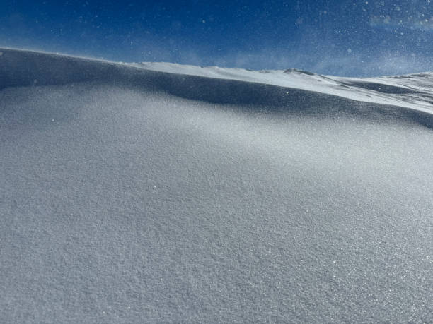 Snowy mountain and ski lift at blizzard
