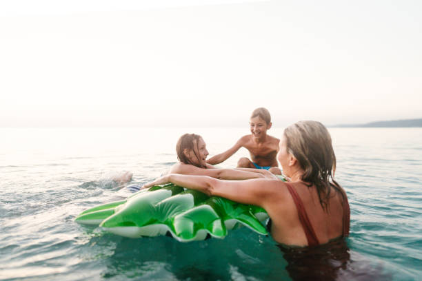 istock Fun with our mom in the sea 2188423375