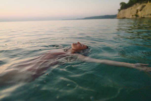 Swimming in the calm sea water