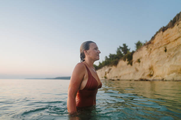 istock Swimming in the sunset 2188423660