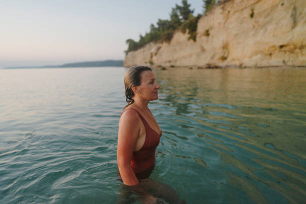 istock Swimming in the sunset 2188424237