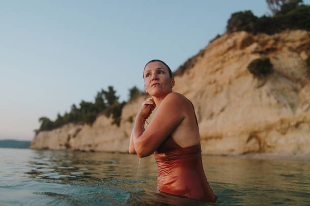 istock Swimming in the sunset 2188424318