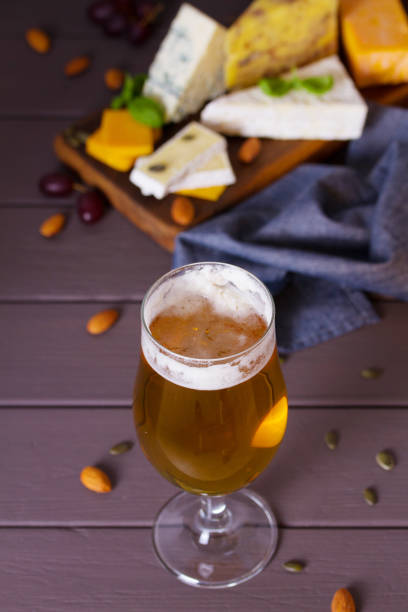 istock Glass of beer and cheese plate 2188424813