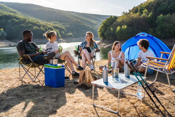 istock Friends camping by the lake 2188425351