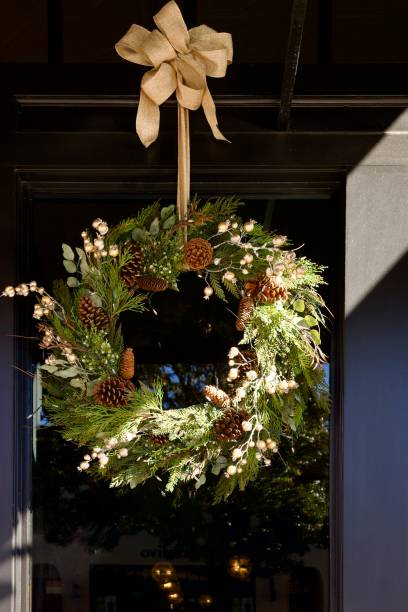 istock Decorative Christmas wreath hangs from the store window 2188426464