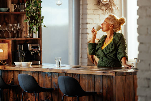 istock Senior woman drinks coffee at home. 2188430983