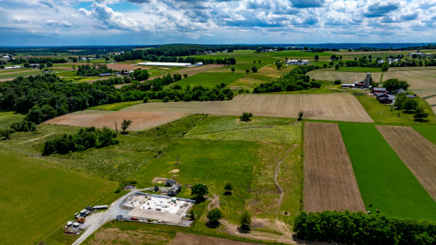 istock Expansive Agricultural Landscape With Construction Site in Rural Area Under a Cloudy Sky 2188431767