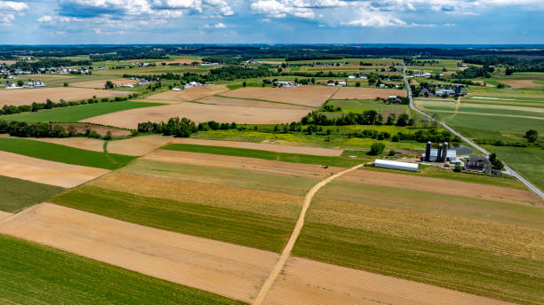 istock Rolling Green Fields and Farm Buildings Under a Clear Sky in Rural America 2188432044