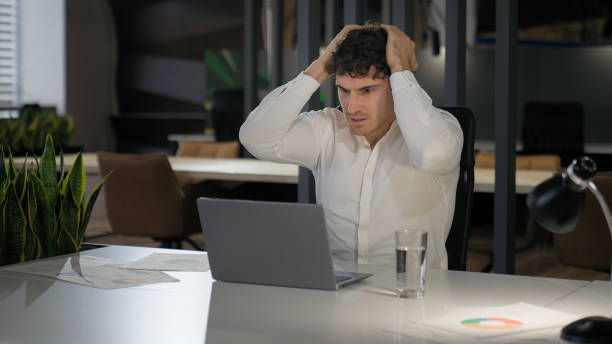 istock Shocked Caucasian businessman with laptop failure in office business man shock problem fail lose online trouble company crisis male professional computer stress worker bankrupt browsing pc crash error 2188435610