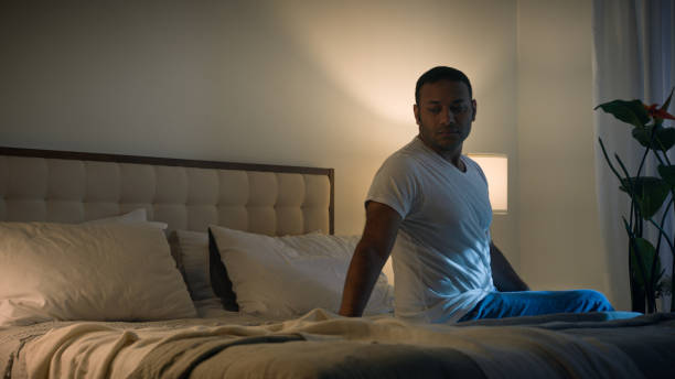 istock Couple family relationship problem conflict misunderstanding quarrel avoid separated African American woman wife sad husband boyfriend apologize sorry calming sitting on bed night girlfriend go away 2188435697