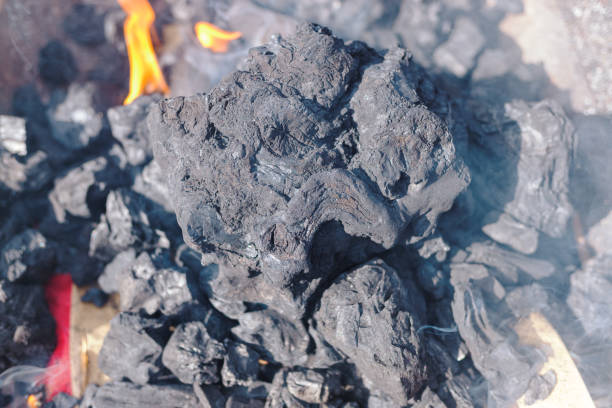 charcoal burning on a grill before cooking the meal