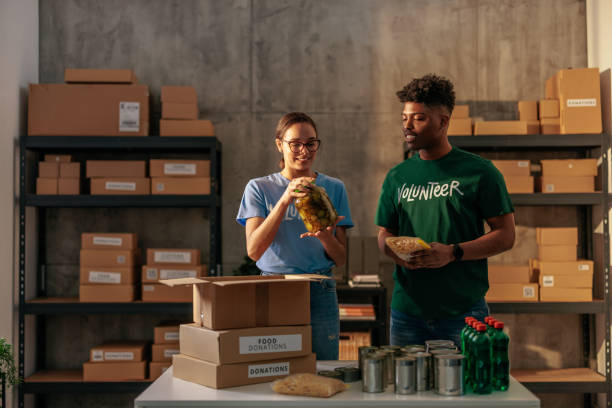 istock Two volunteers organizing food donations 2188437787