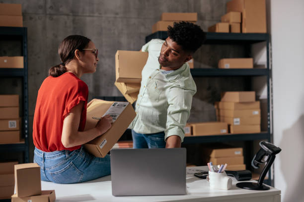 istock Colleagues looking at laptop screen in storage room 2188437833