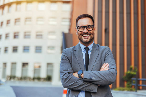 istock Confident Businessman Smiling Outdoors In Urban Setting 2188441931
