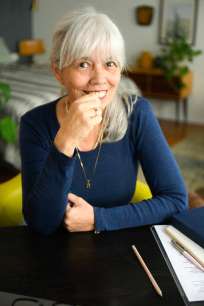 istock Senior woman working from home smiling at camera 2188443785