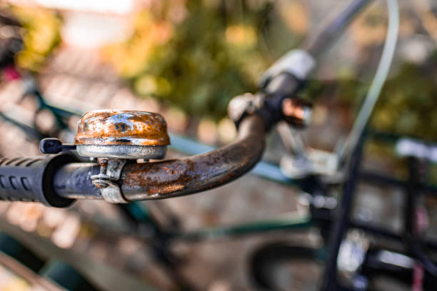 A classic bicycle rests amidst tall golden wheat, evoking a sense of rural tranquility. The sun's glow enhances the serene outdoor setting, highlighting a peaceful escape into nature.