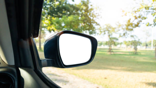 istock Side view car mirror with blank white screen for mockup at countryside road. 2188452713