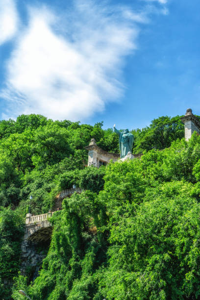 Saint Gellert Bishop with a cross on the Gellert Hill in front of Erzsebet bridge.