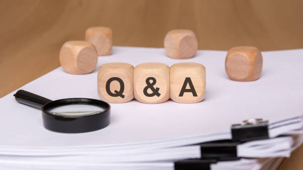 istock Focused QA Session Utilizing Documents and a Magnifying Glass for Indepth Analysis and Clarity 2188453888
