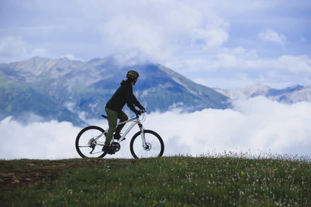 istock Riding mountain bike on beautiful mountain top 2188455343