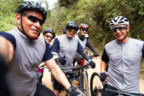 istock Group of mountain bikers taking a selfie on the road 2188455591