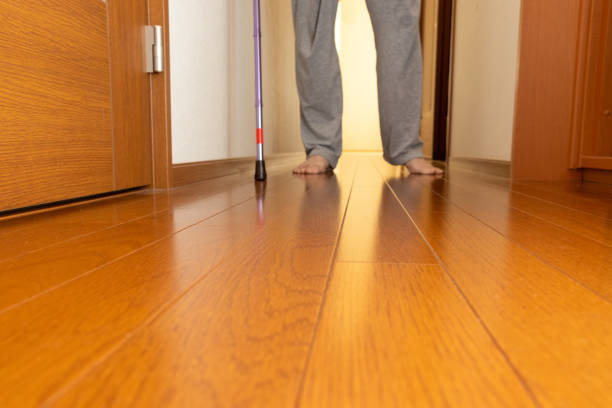 istock A person walking down a corridor with a cane 2188456355