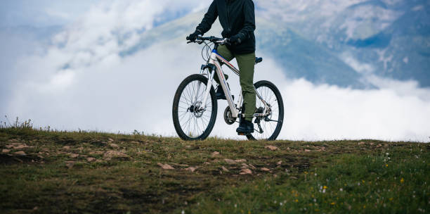 istock Riding mountain bike on beautiful mountain top 2188456630
