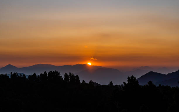 istock gloomy sunrise over the Mountain 2188456774