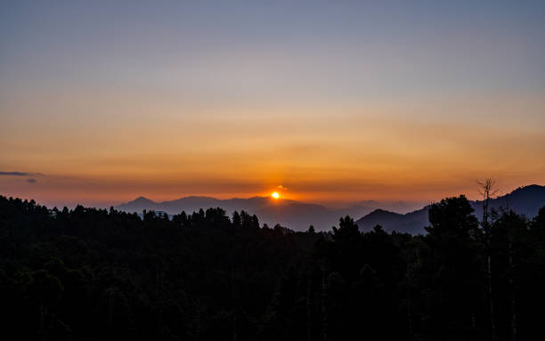 istock gloomy sunrise over the Mountain 2188456781