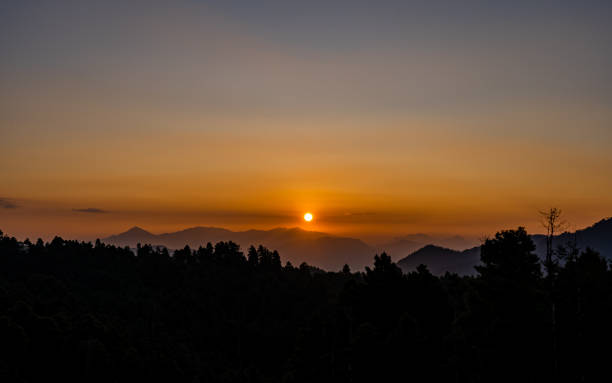 istock gloomy sunrise over the Mountain 2188456799