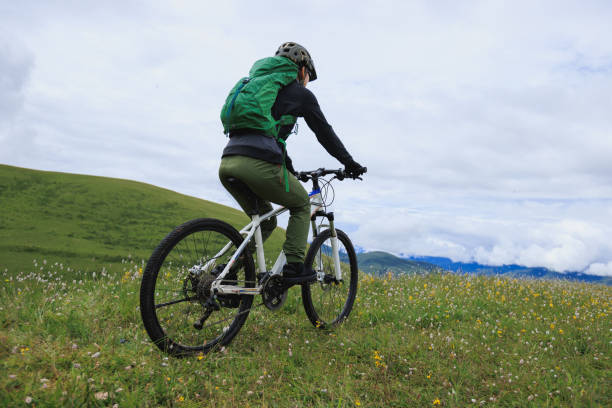 istock Riding mountain bike on grassland mountain top 2188457539